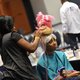 A model gets her hair done before the show (Kea Taylor/Imagine Photography).